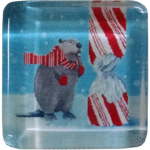 A square plate with a beaver holding a candy cane, perfect for needlepoint enthusiasts or as a decorative magnet.