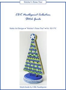 A needlepoint stitched Christmas tree with a star.
