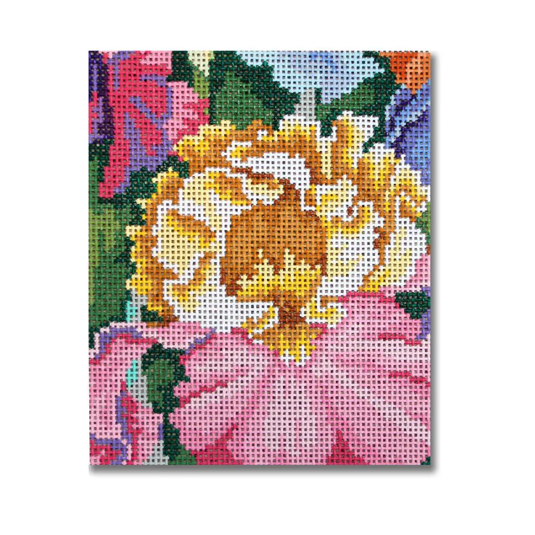 A cross stitch picture of a flower created by Cecilia Ohm Eriksen.