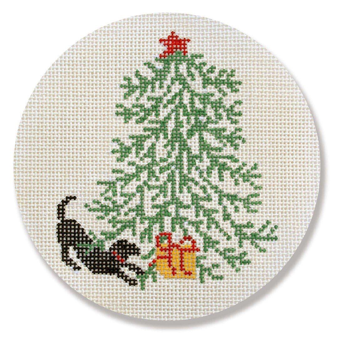 A cross stitch pattern of a dog with a Christmas tree designed by Cecilia Ohm.