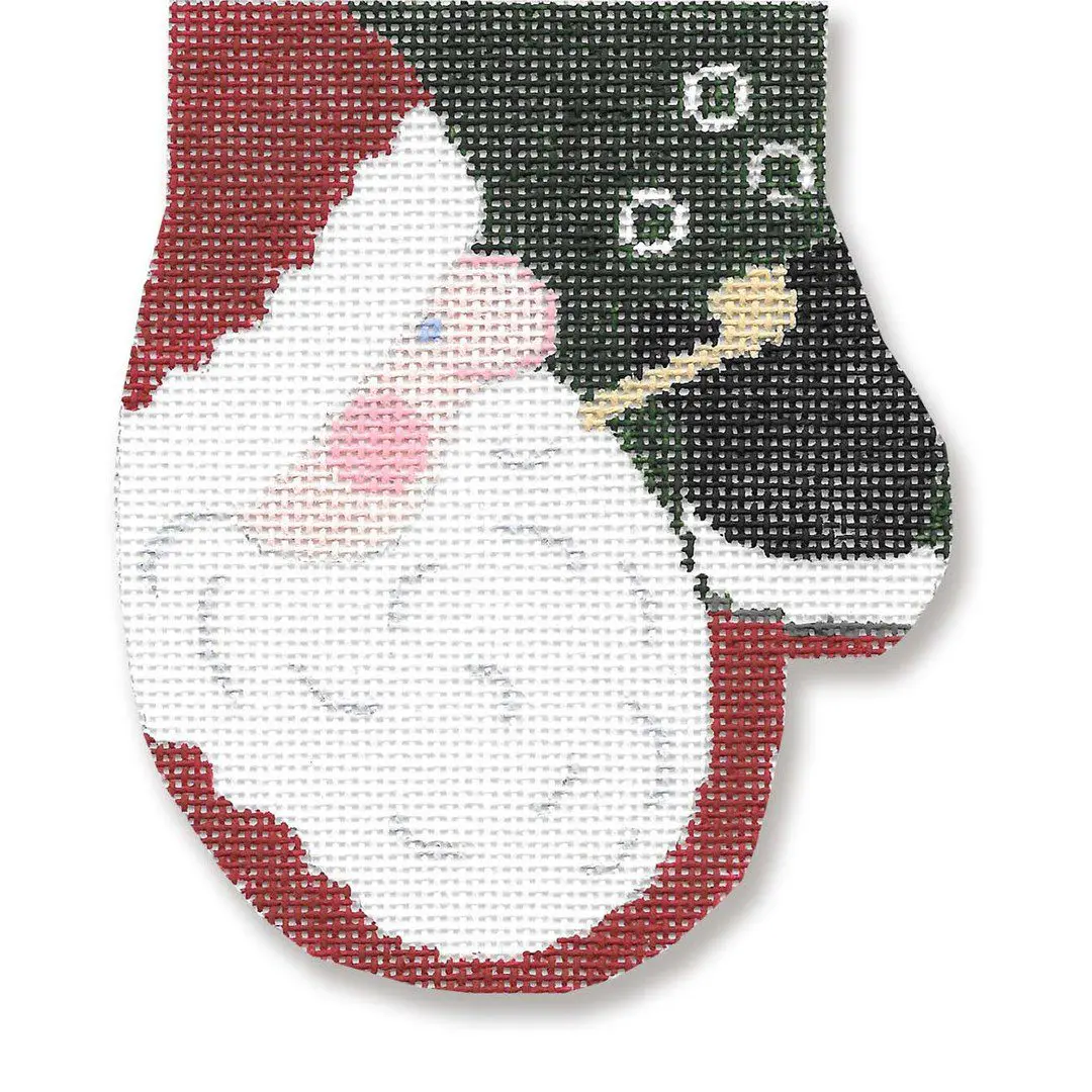 A cross stitch pattern of a santa claus mitten designed by Cecilia Ohm.