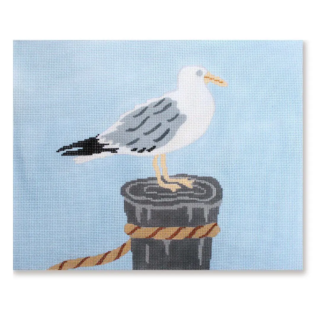 A painting of a seagull on a wooden post by Cecilia Ohm.