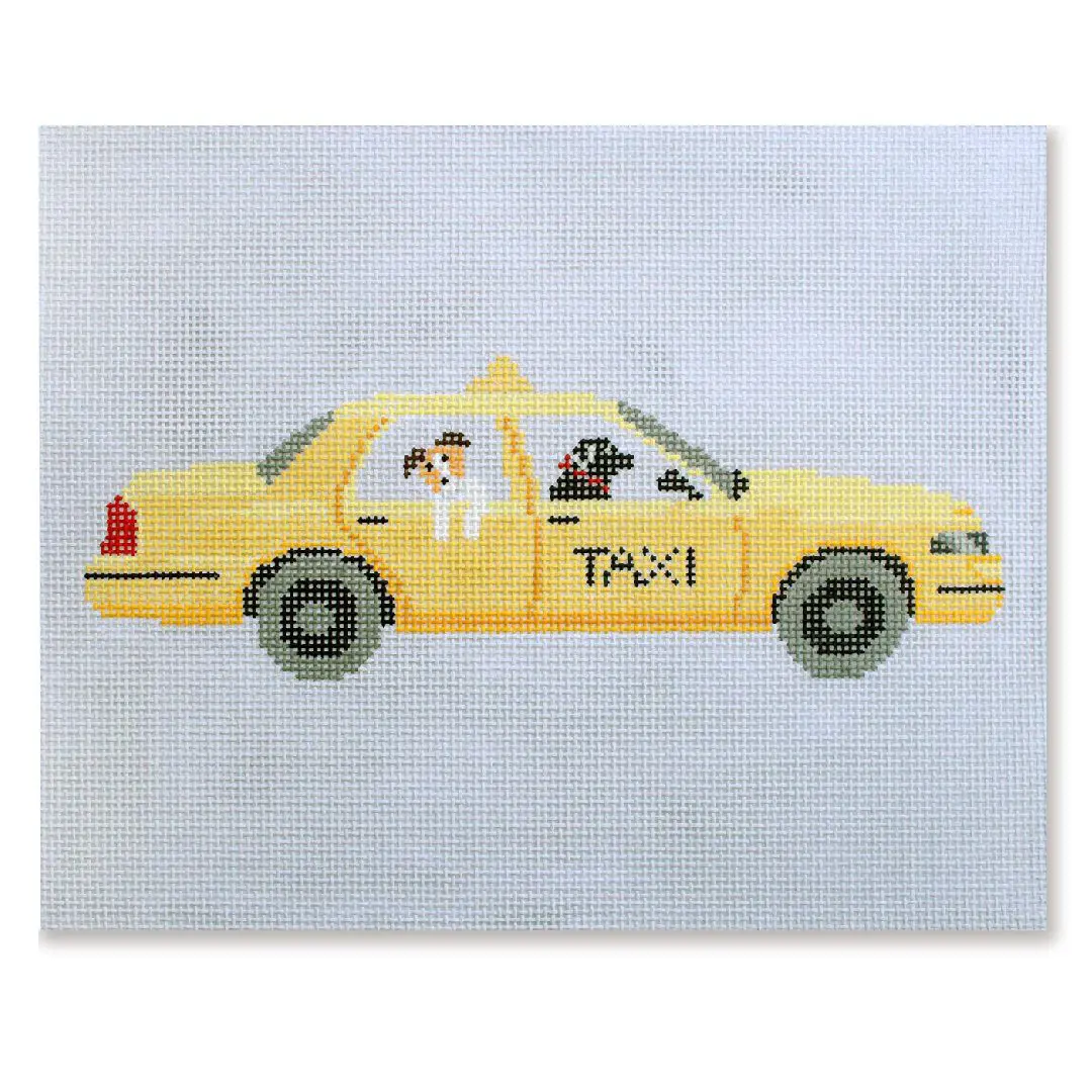 Cecilia Ohm Eriksen created a cross stitch picture of a yellow taxi with a dog in it.