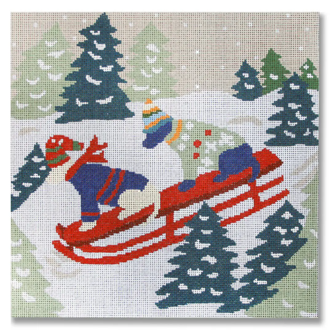 A cross stitch picture of two dogs on a sled created by Cecilia Ohm Eriksen.