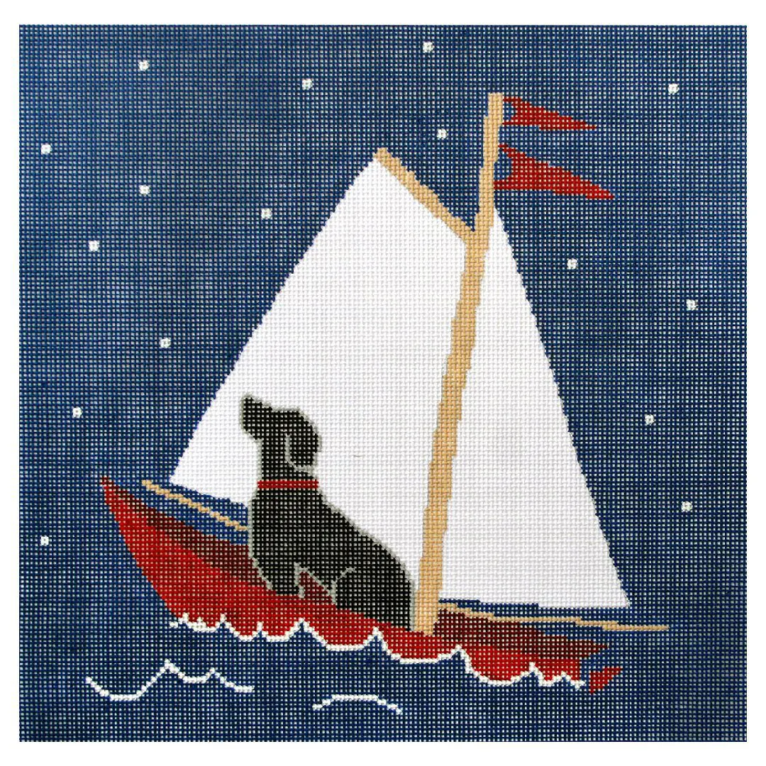A cross stitch picture of a dog in a sailboat created by Cecilia Ohm Eriksen.