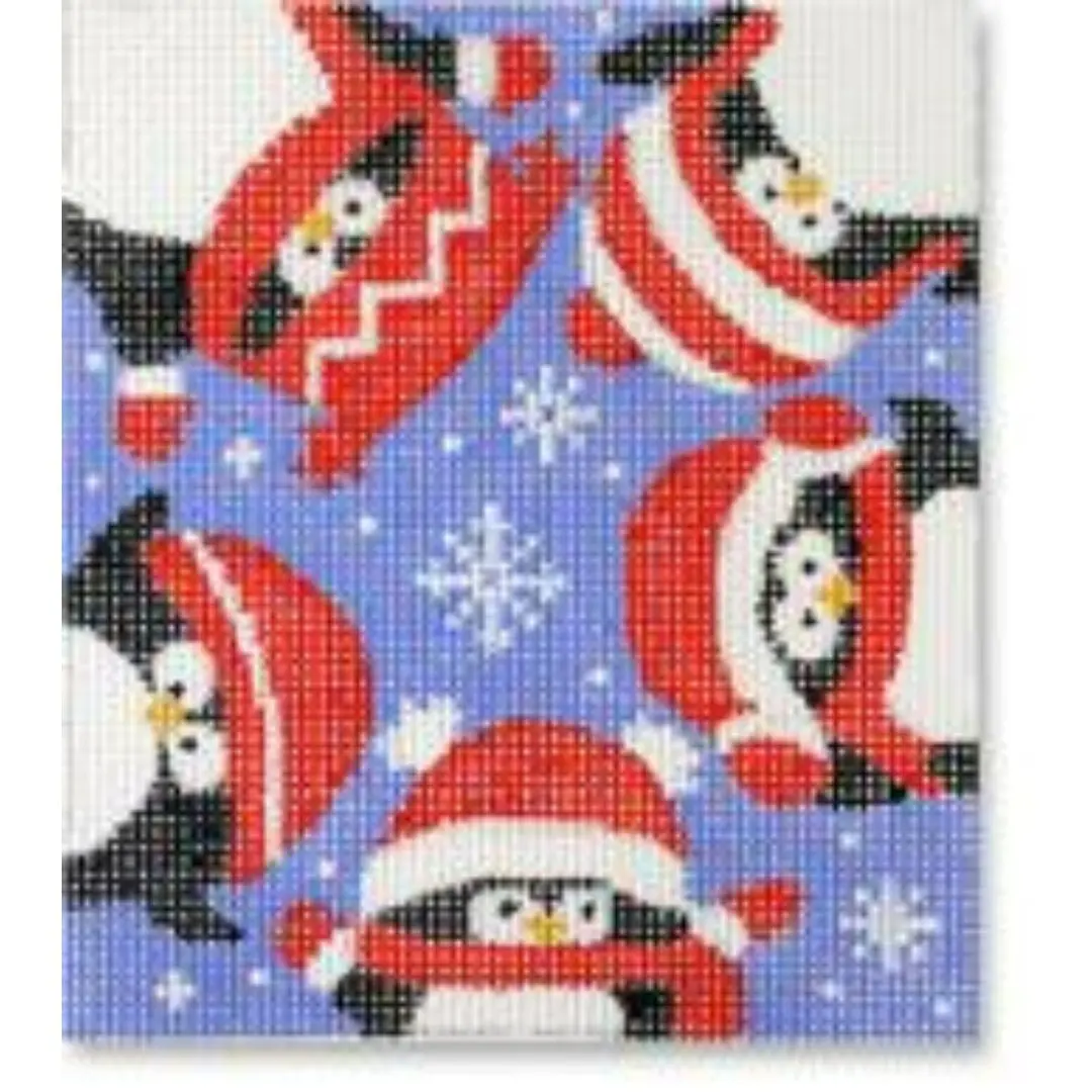 A needlepoint canvas featuring penguins donning red and white hats, designed by Cecilia Ohm Eriksen.