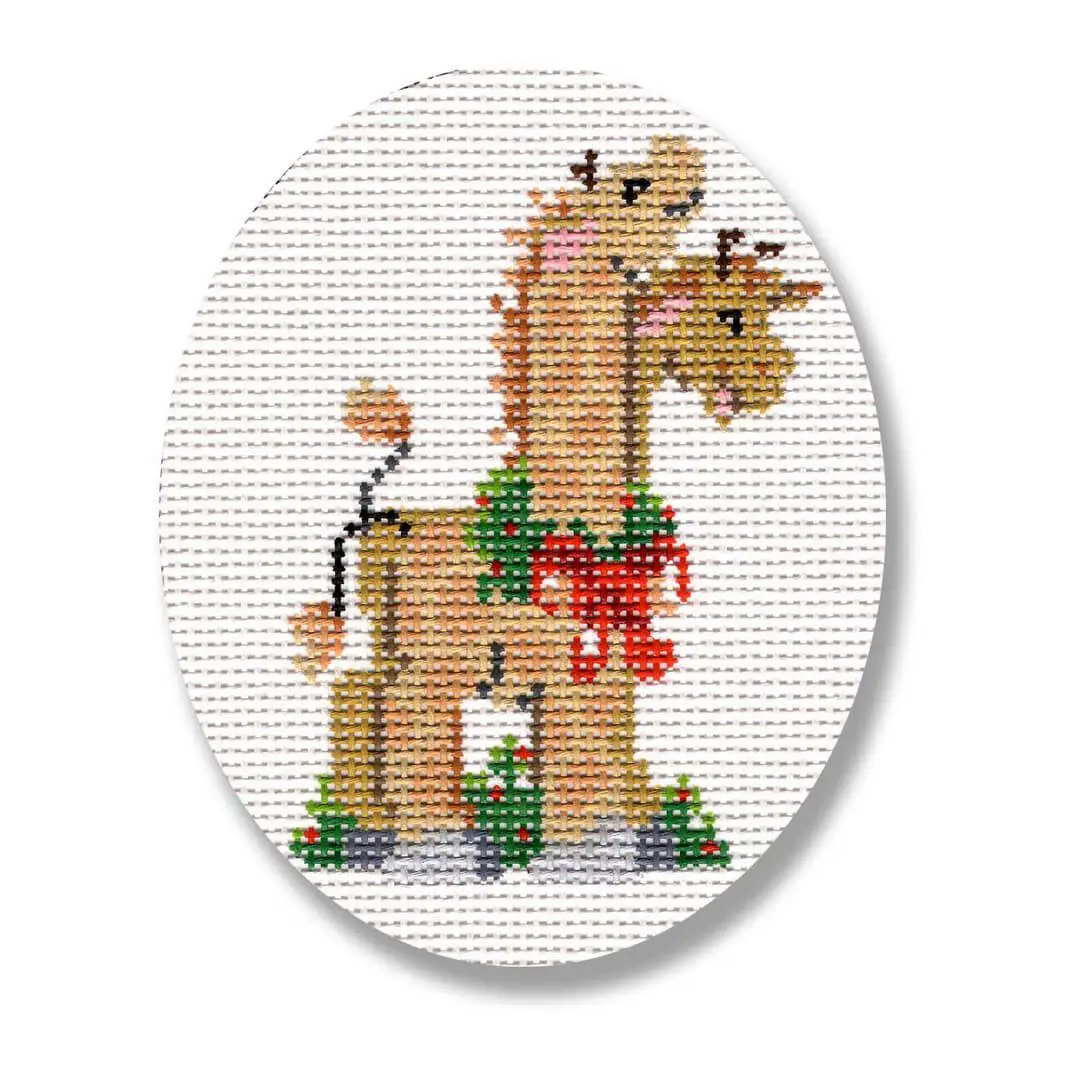 A cross stitch pattern of a giraffe designed by Cecilia Ohm Eriksen.