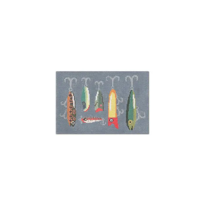 A picture of fishing lures hanging on a gray background.