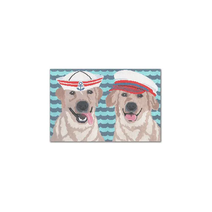 Two golden retrievers wearing sailor hats on a blue background, captured by Cecilia Ohm Eriksen.