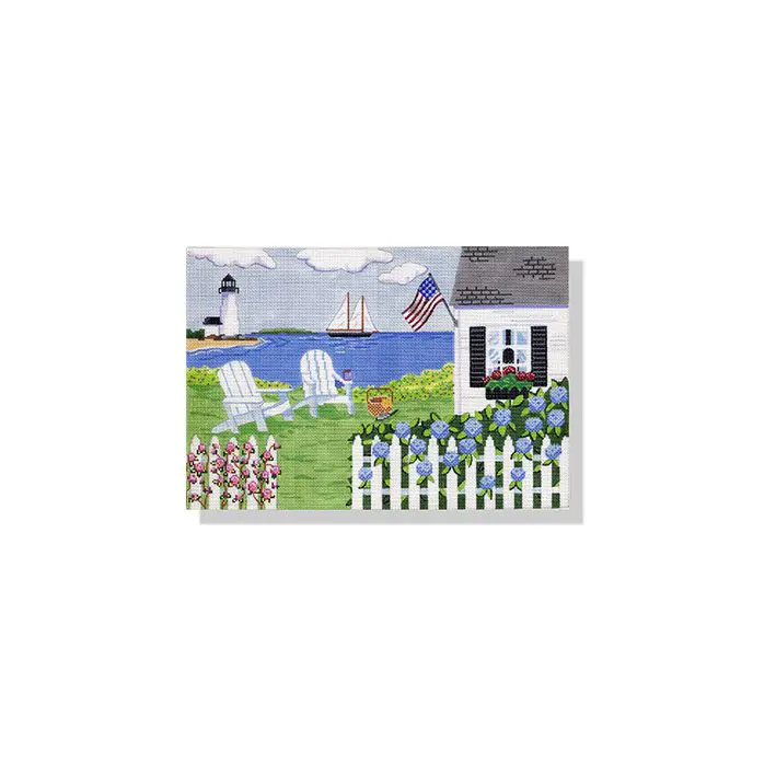 A picture of a house with lawn chairs and a lighthouse.