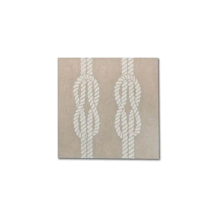 A white tile with a rope design on it, inspired by Cecilia Ohm Eriksen.