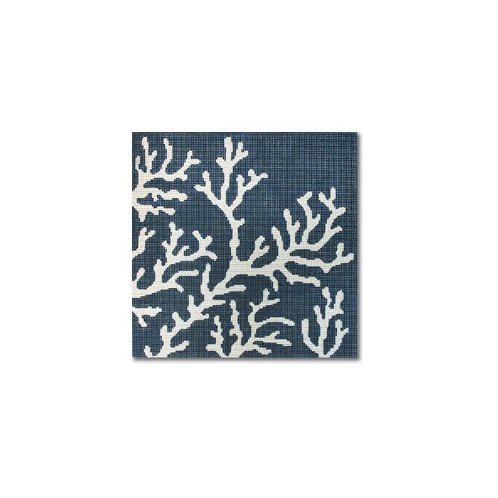 A blue and white rug with corals on it designed by Cecilia Eriksen.
