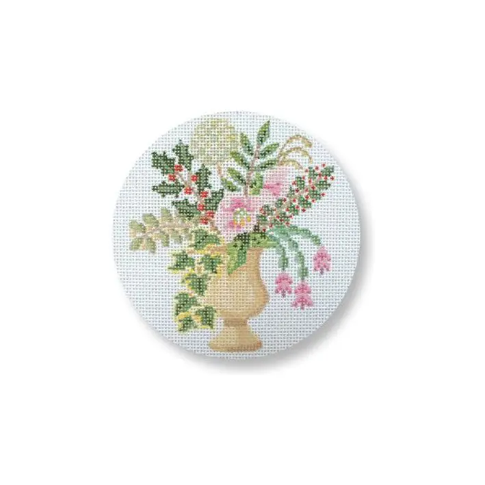 A cross stitch picture of a vase with flowers on it.