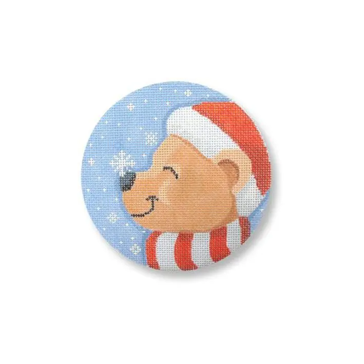 A button with a bear in a santa hat.