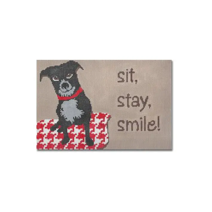A black and white dog named Cecilia with the words sit stay smile on it.