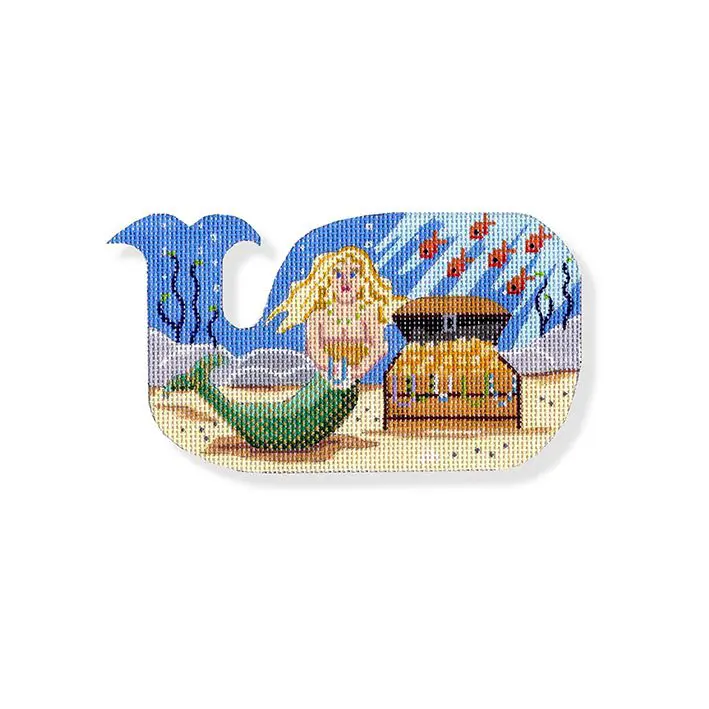 A cross stitch kit with a mermaid on a whale.