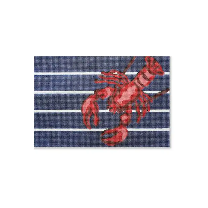 An image of a lobster on a blue and white striped rug captured by Cecilia Ohm Eriksen.