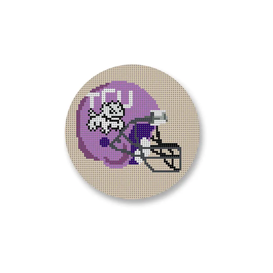 A cross stitched TCU football helmet with a cat on it, created by Cecilia Ohm Eriksen.