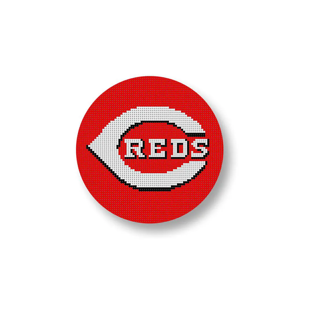 A red and white button with the word Cincinnati Reds on it featuring Cecilia Ohm Eriksen.