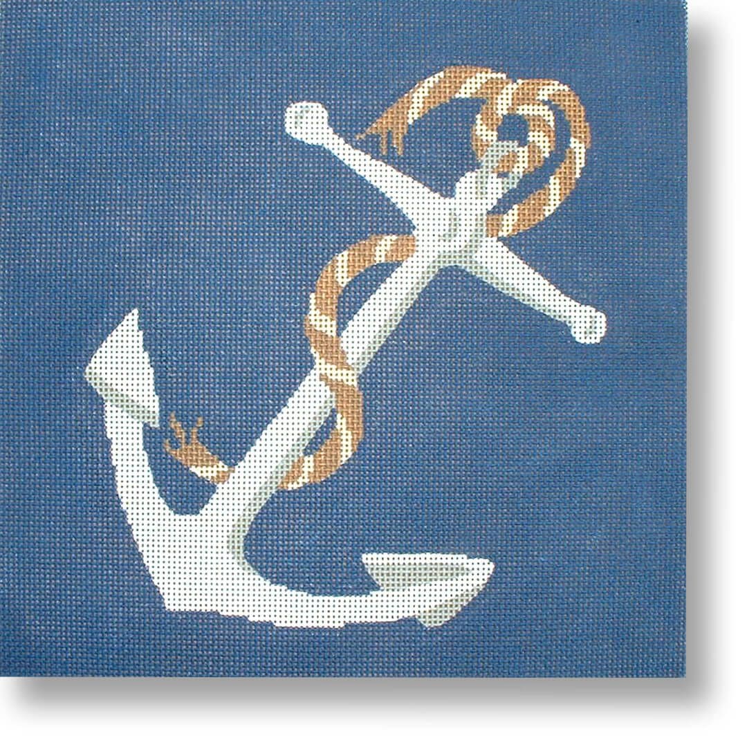 Cecilia Ohm Eriksen's cross stitch picture of an anchor on a blue background.