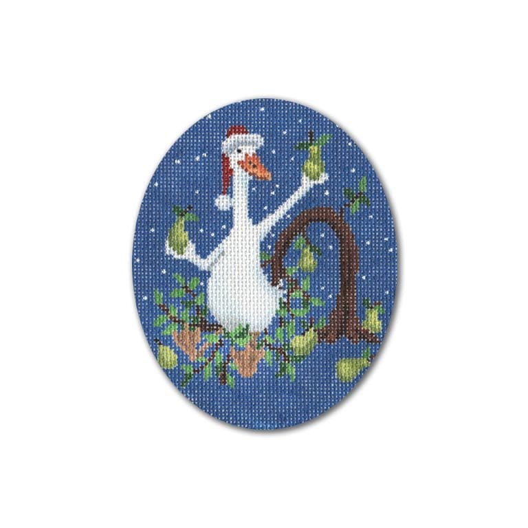 A cross stitch picture featuring a goose in a tree, created by Cecilia Ohm Eriksen.