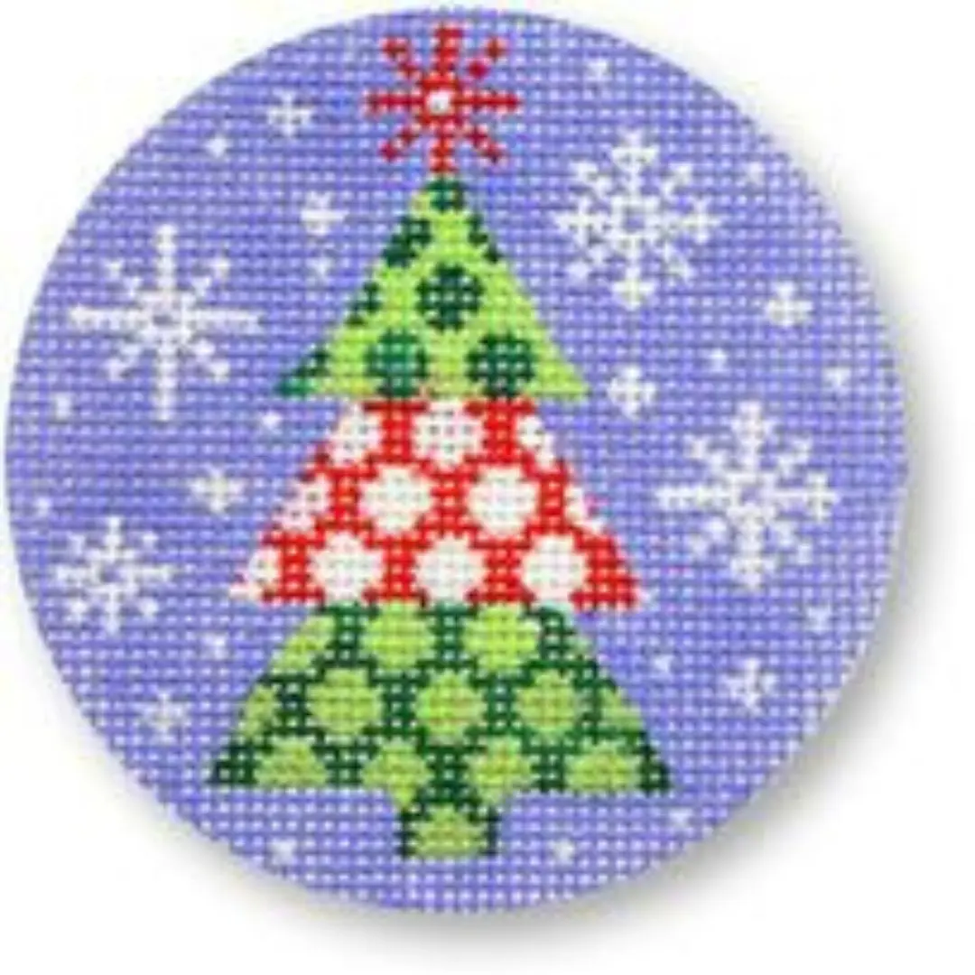 A cross stitched Christmas tree featuring Cecilia Ohm Eriksen on a blue background.