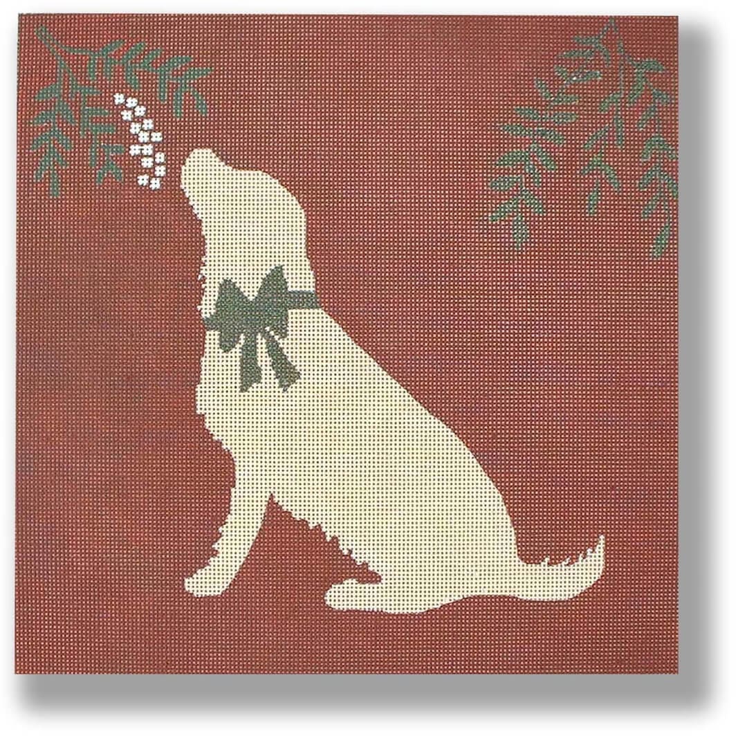 A silhouette of a dog with holly leaves on a red background by Cecilia Ohm Eriksen.