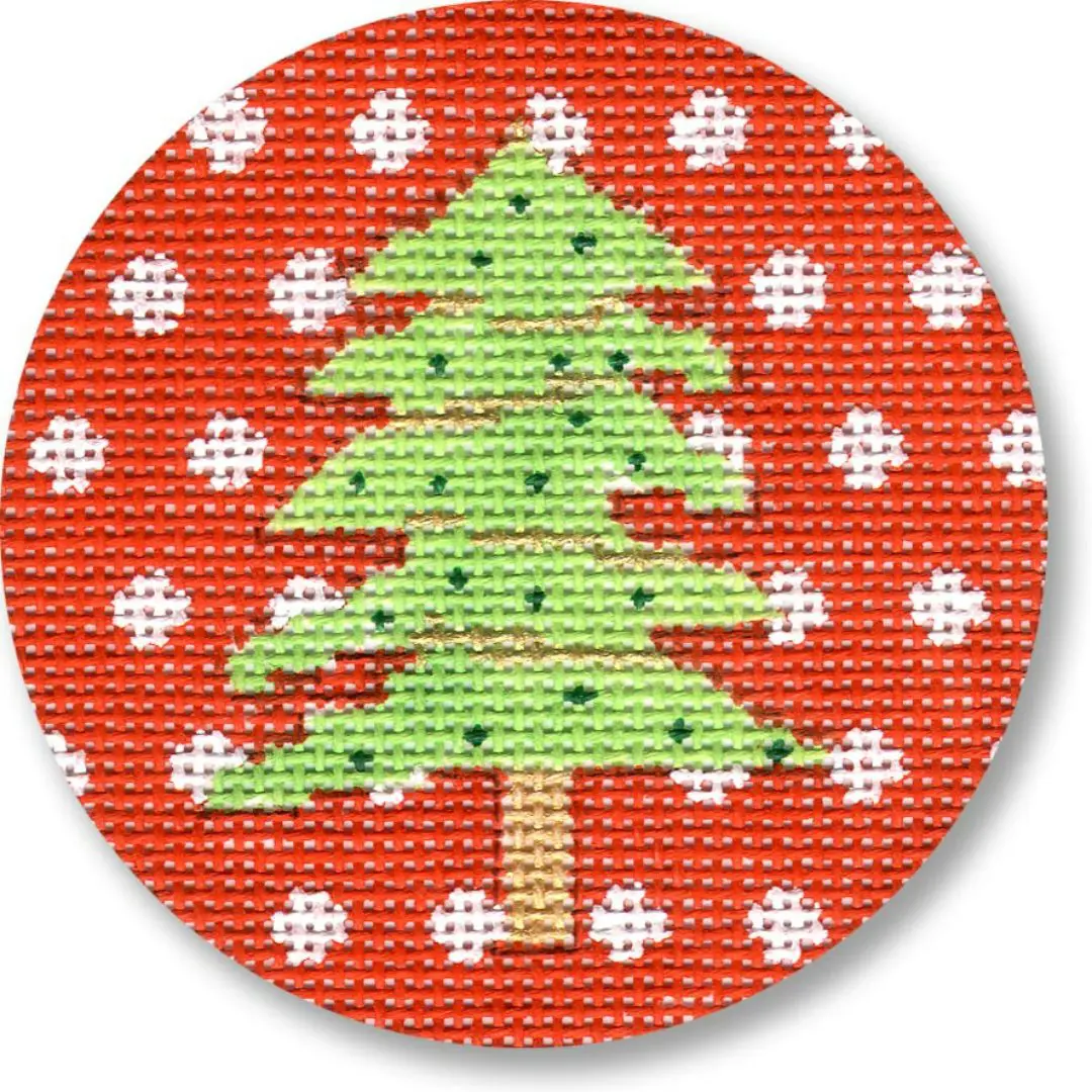 A red circle with a Christmas tree on it, designed by Cecilia Ohm.