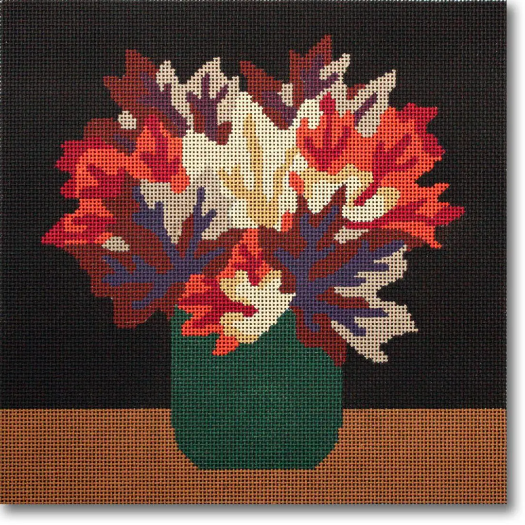 A needlepoint canvas featuring a vase with flowers in it, created by Cecilia Ohm.