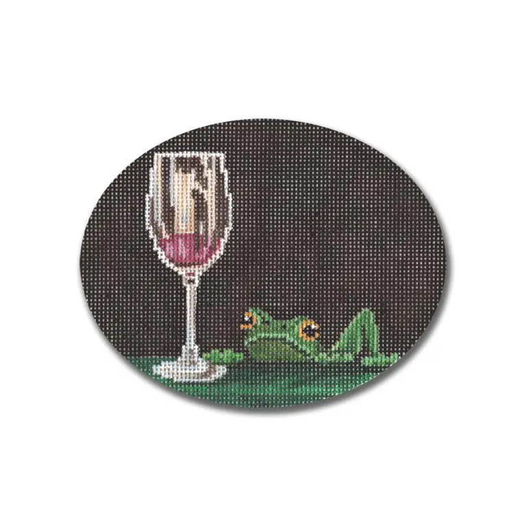 A cross stitch picture of a frog with a glass of wine by Cecilia Ohm.