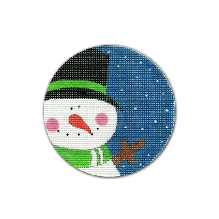 A cross stitch picture of a snowman with a hat designed by Cecilia Ohm Eriksen.