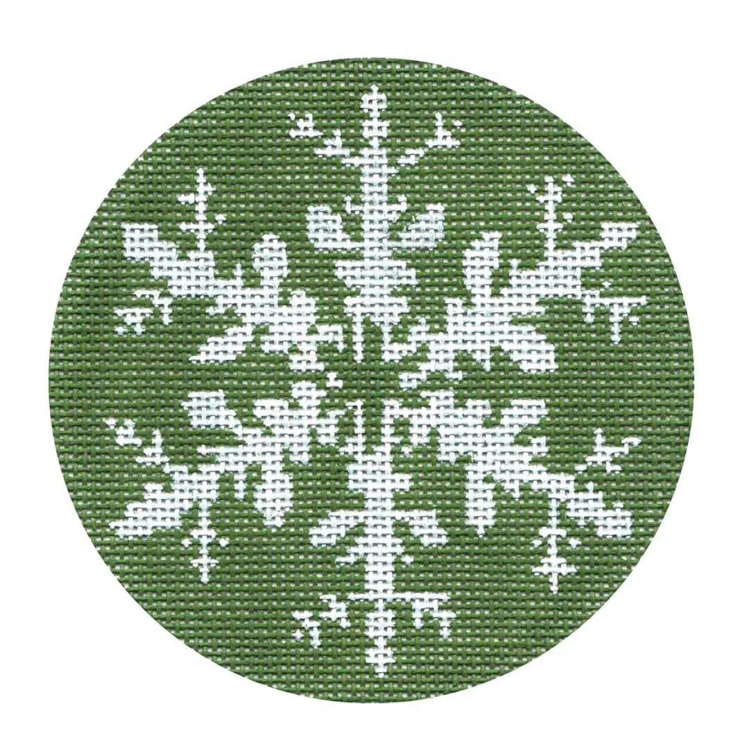 A Cecilia Ohm Eriksen snowflake cross stitch pattern in green and white.