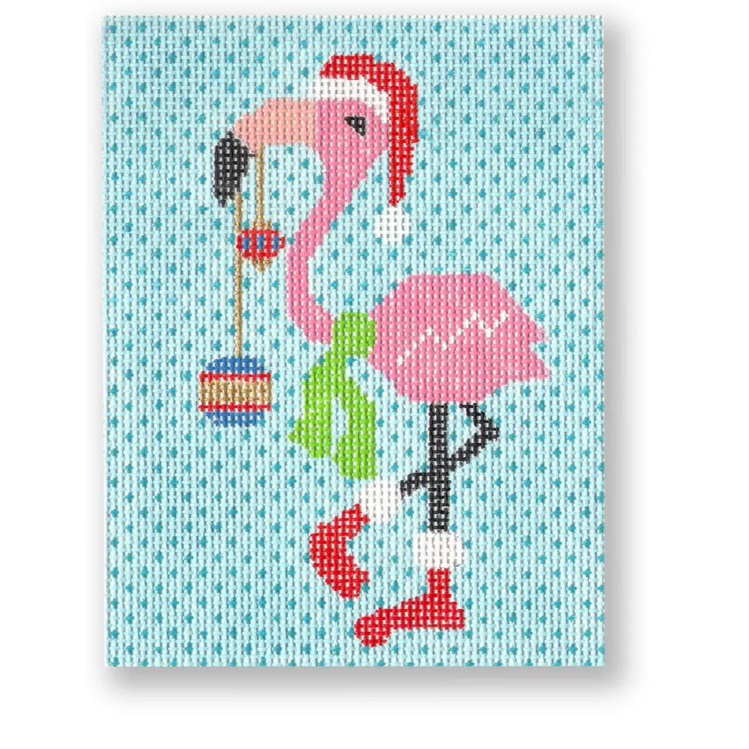 A pink flamingo wearing a santa hat stands out on a vibrant blue background.