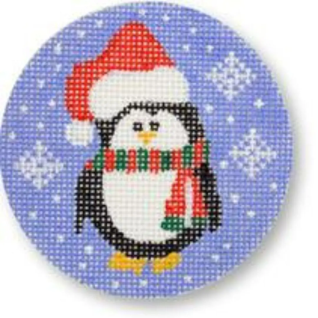 A cross stitch penguin in a santa hat, created by Cecilia.