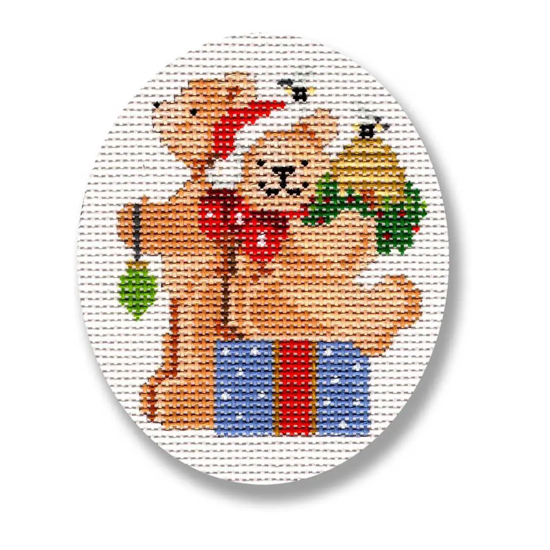 A cross stitch pattern featuring two teddy bears by Cecilia Ohm Eriksen.