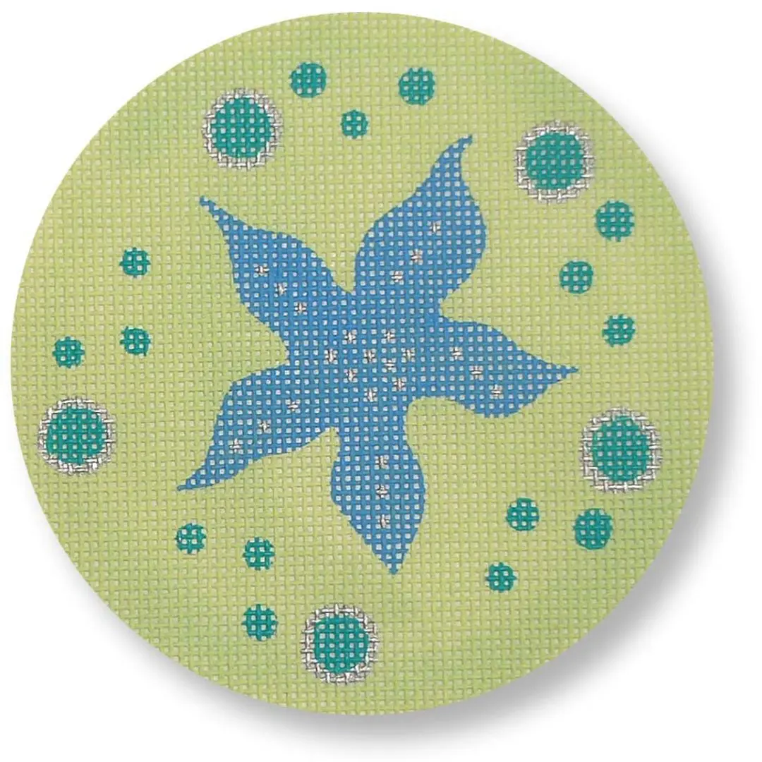 A green and blue circle adorned with a starfish, inspired by the mystical world of Cecilia Ohm Eriksen.