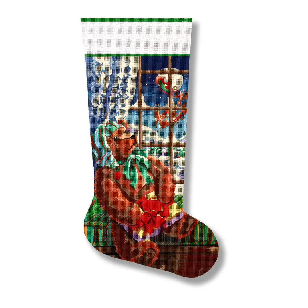 A christmas stocking featuring an image of a teddy bear designed by Cecilia Ohm Eriksen.