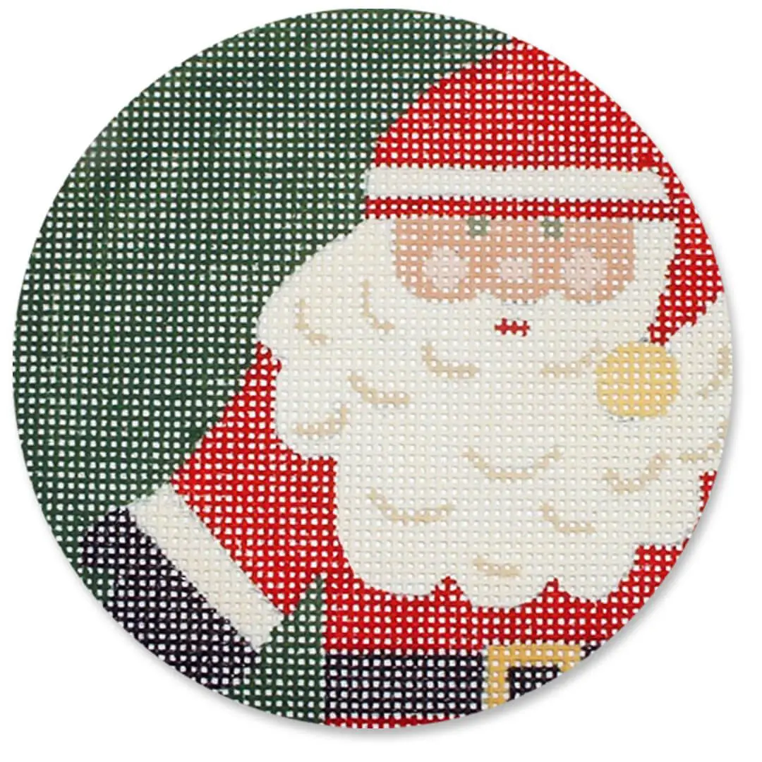 A Cecilia Ohm Eriksen cross stitch pattern featuring a Santa Claus design on a round plate.