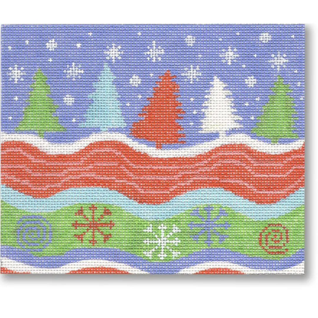 A cross stitch pattern of a snowy landscape with trees and snowflakes by Cecilia Ohm Eriksen.