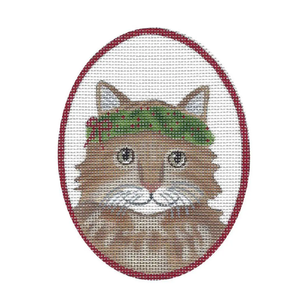 A cross stitch pattern of a Cecilia Ohm Eriksen cat with a wreath on its head.