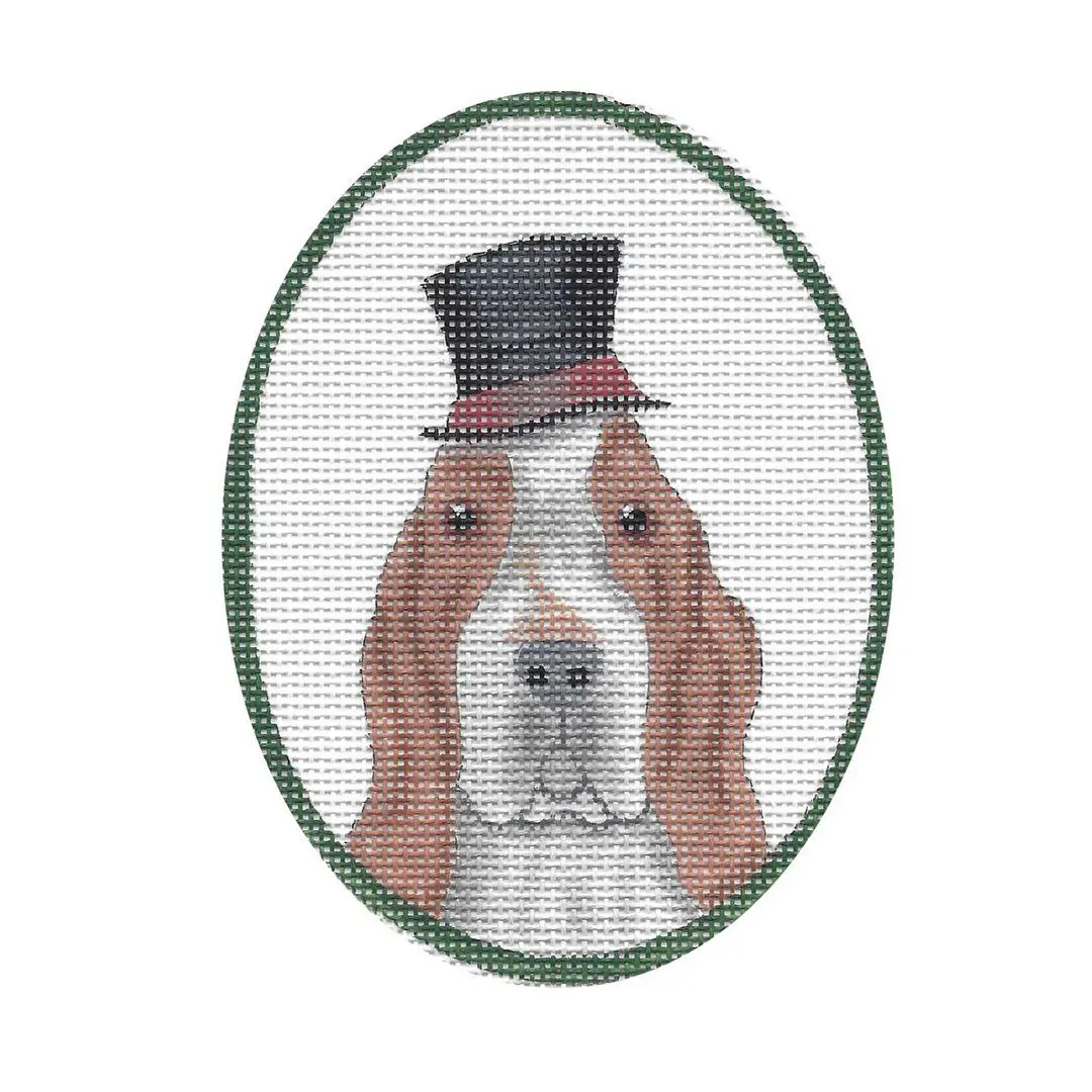 A dog in a top hat is shown on a cross stitch pattern designed by Cecilia Ohm Eriksen.