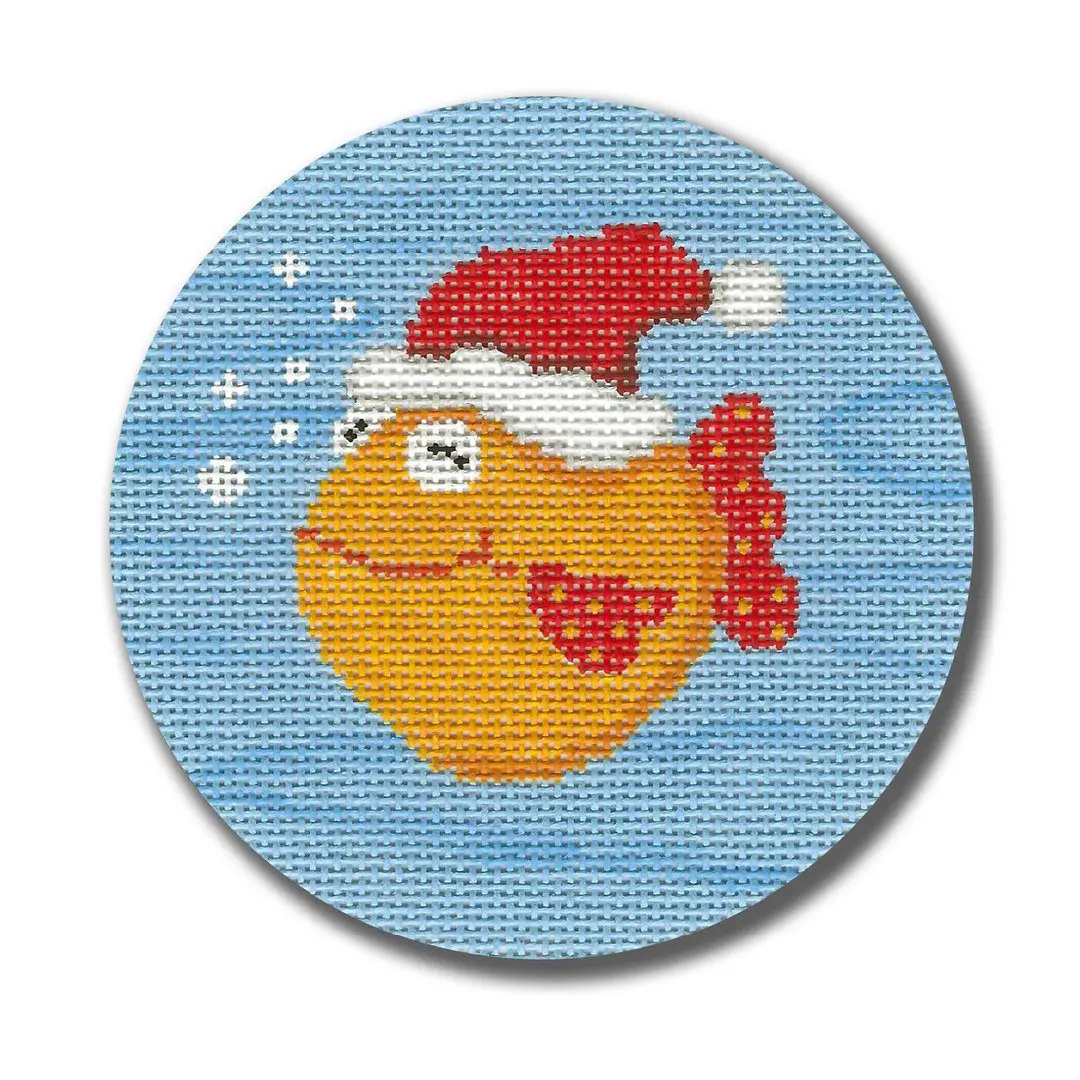 A cross stitch picture of a fish wearing a santa hat designed by Cecilia Ohm Eriksen.