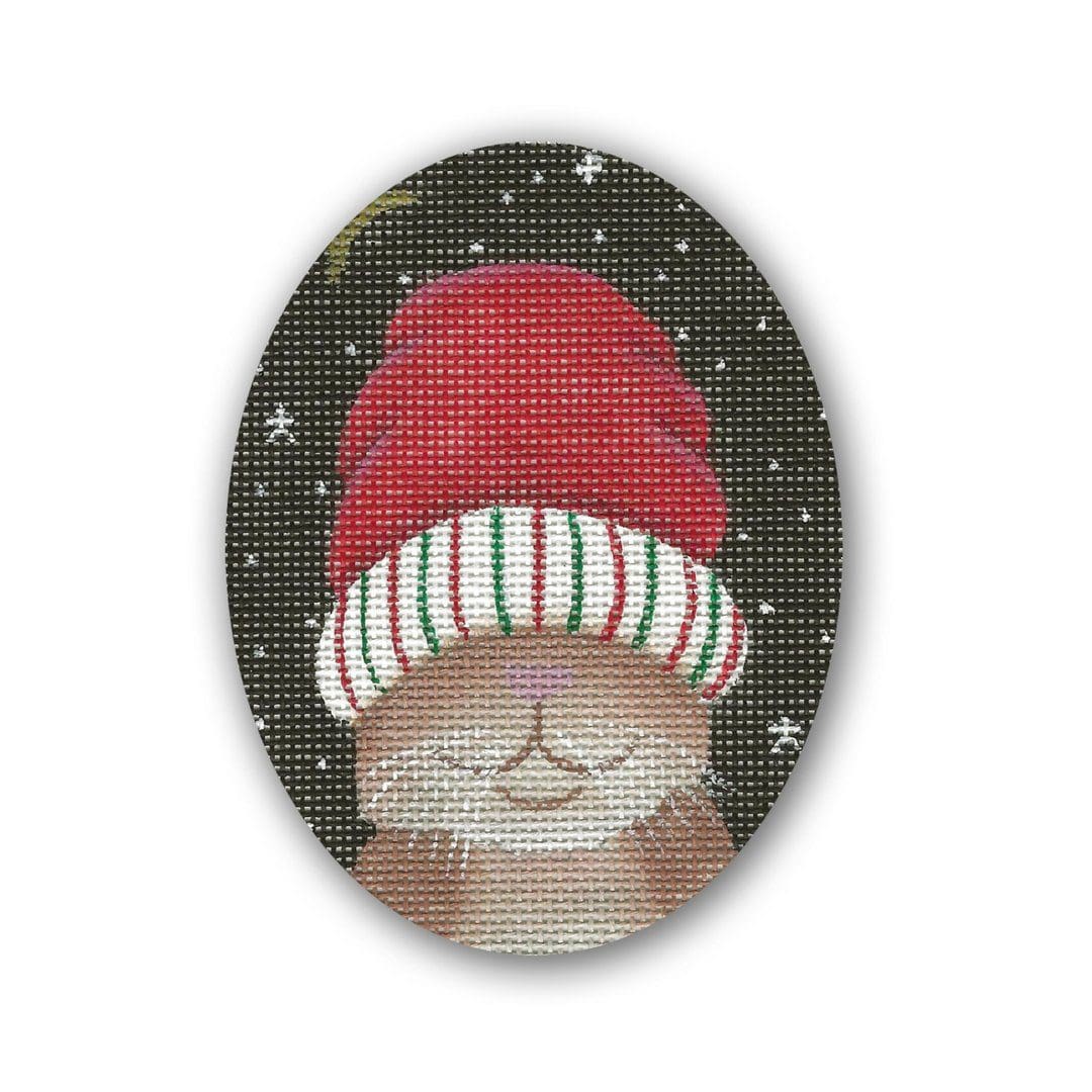 A cross stitch picture of a bunny wearing a hat by Cecilia Ohm or Eriksen.