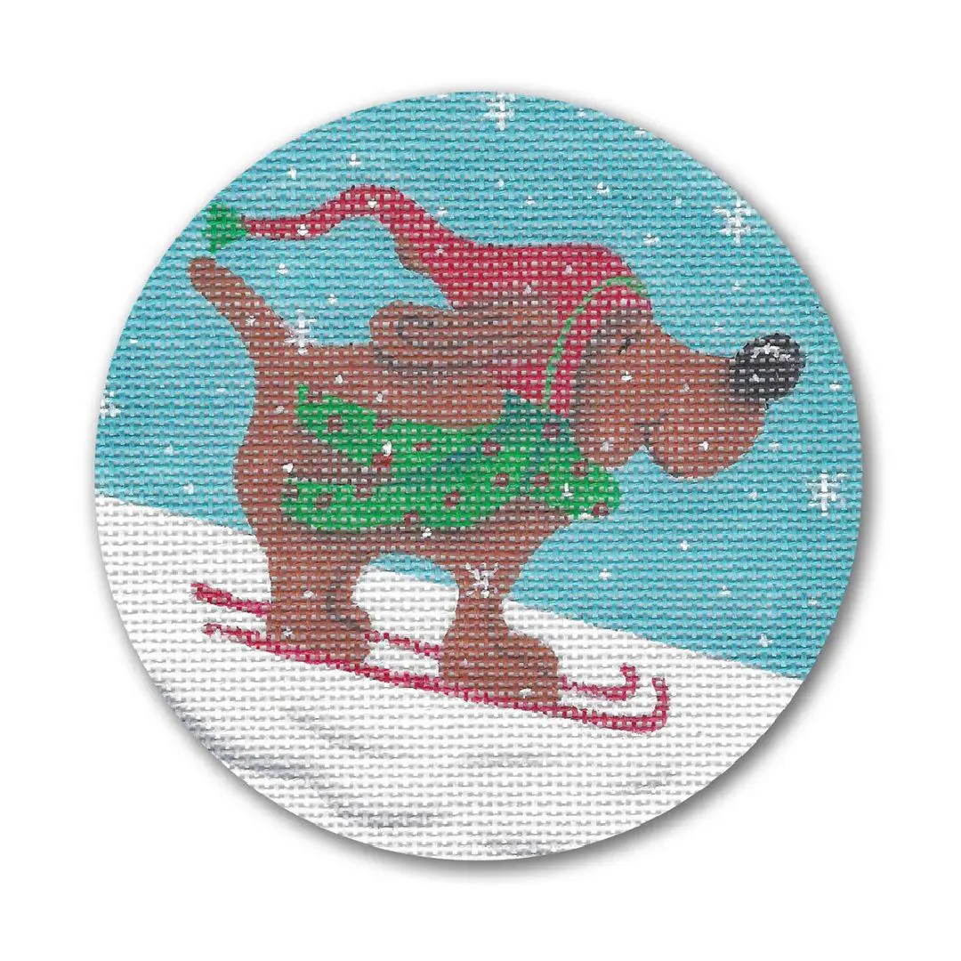 Cecilia Ohm Eriksen created a cross stitch picture of a brown dog on skis.