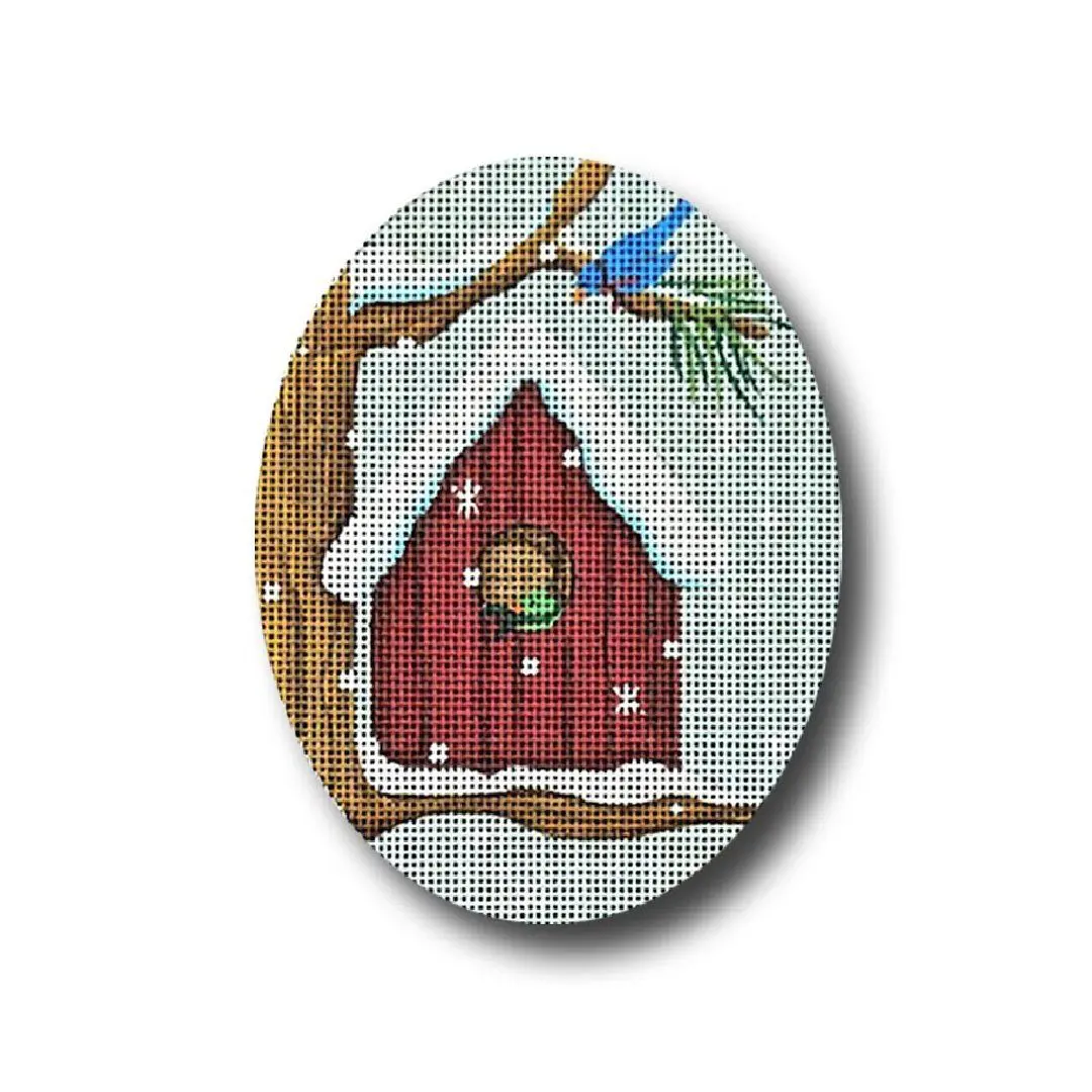 A cross stitch picture of a birdhouse with a blue bird on it, created by Cecilia