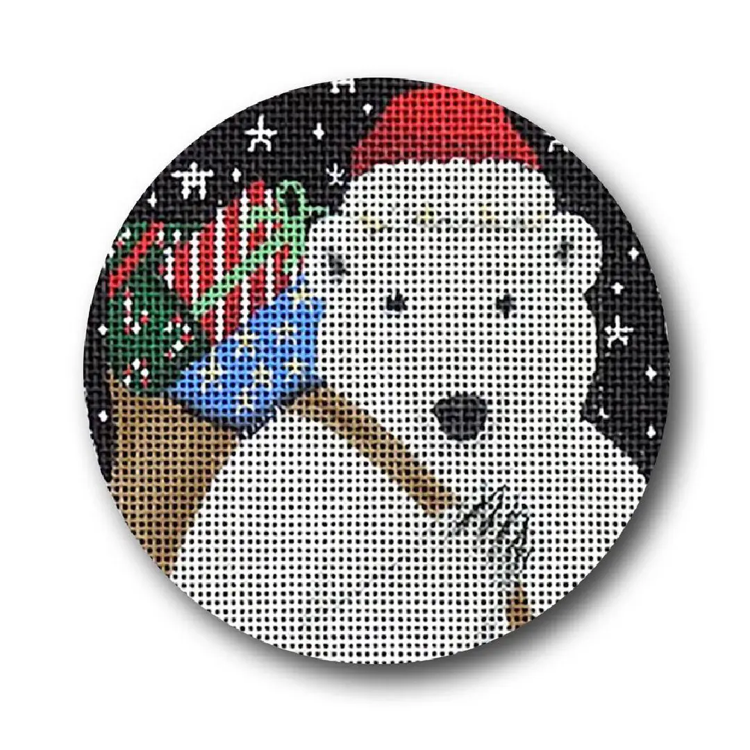 A cross stitch pattern featuring a polar bear surrounded by presents, designed by Cecilia Ohm Eriksen.