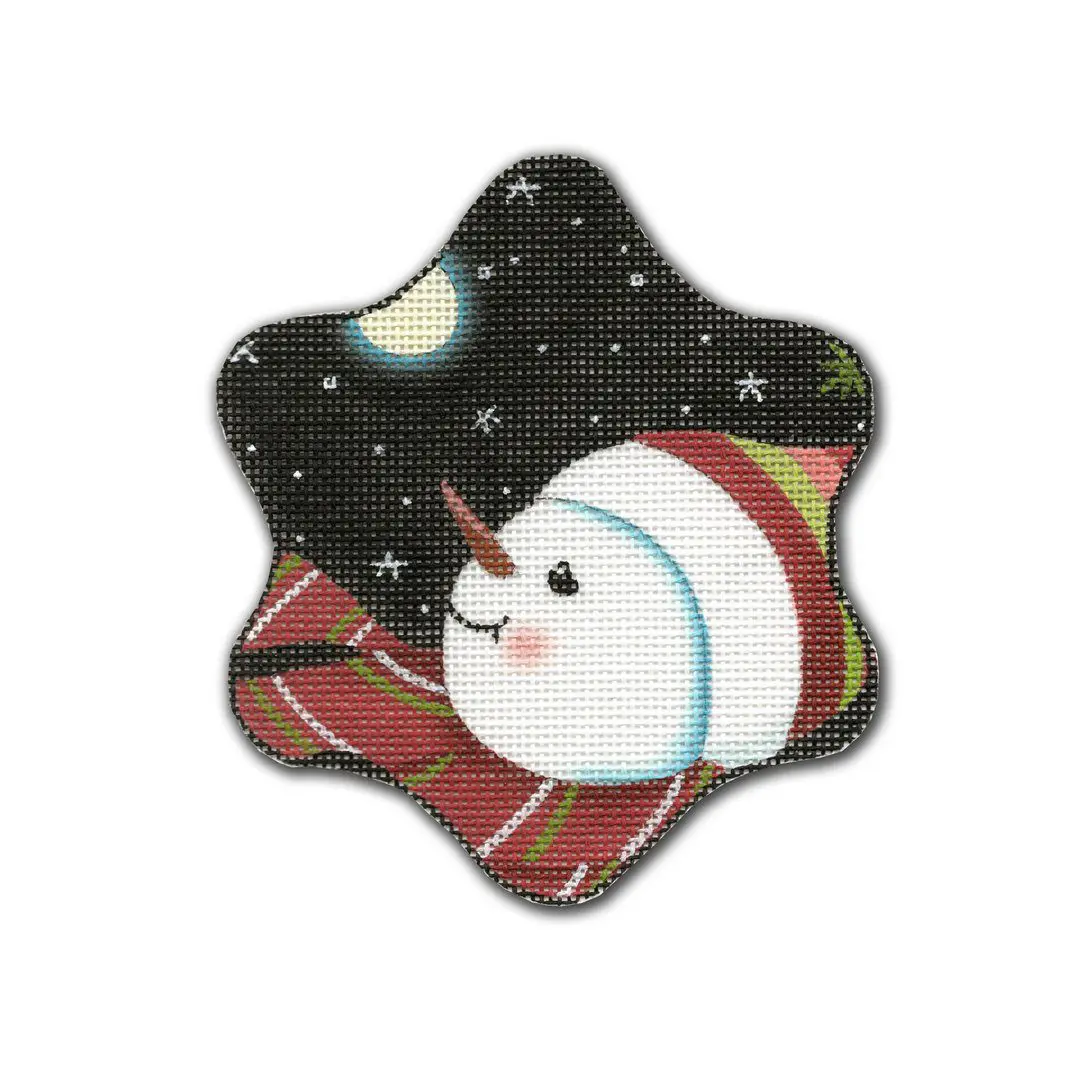 Cecilia, a snowman, is peacefully laying on a blanket beneath the starry sky.