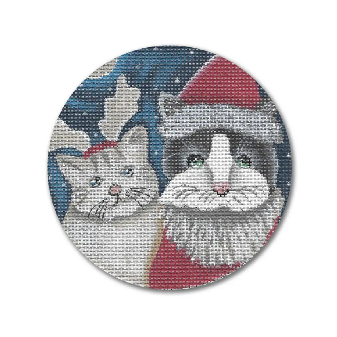 A cross stitch pattern of two cats wearing santa hats by Cecilia Ohm Eriksen.