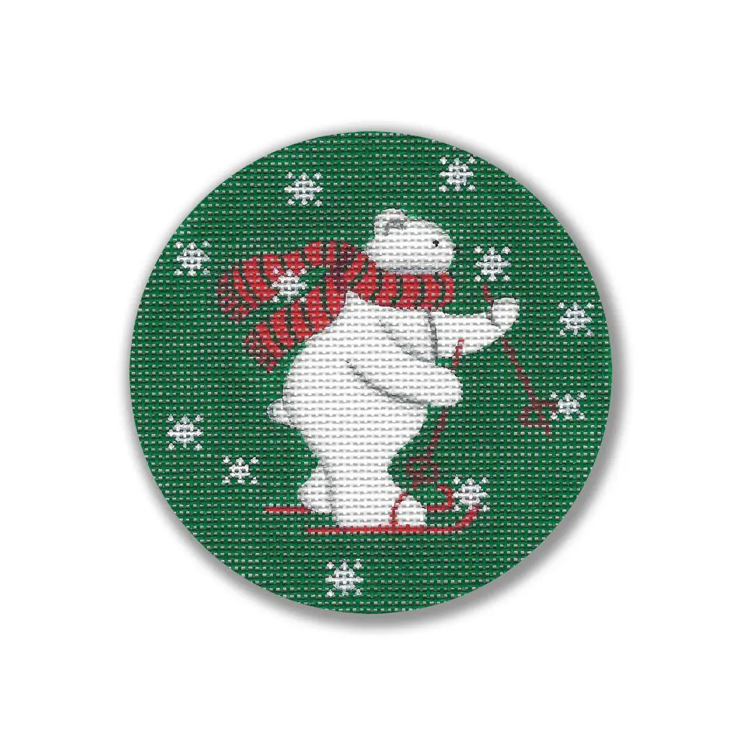 A cross stitch pattern of a Cecilia Ohm polar bear on a green background.