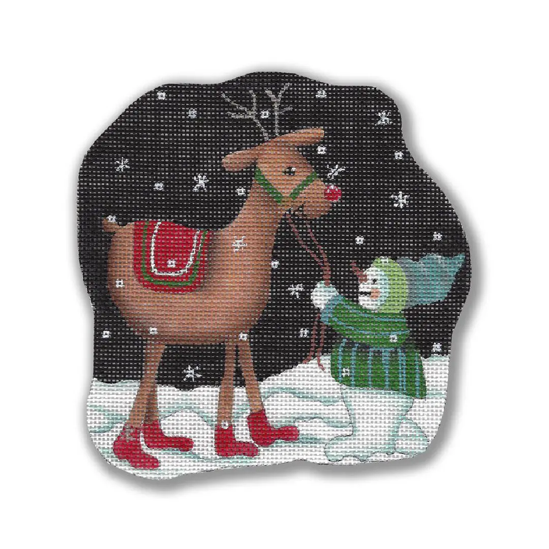 A reindeer and snowman cross stitch pattern designed by Cecilia Ohm Eriksen.